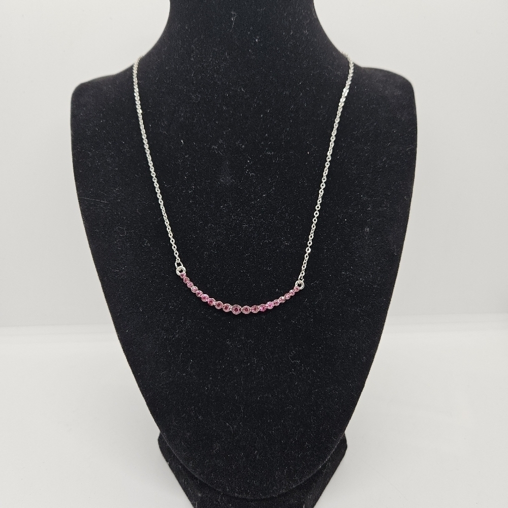 silver tone chain necklace with hot pink rhinestone crescent